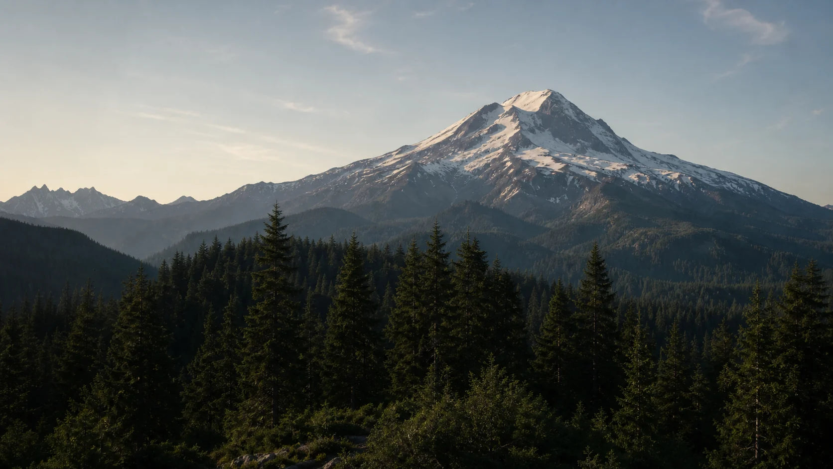 Snow-capped Washington mountain above evergreen forest