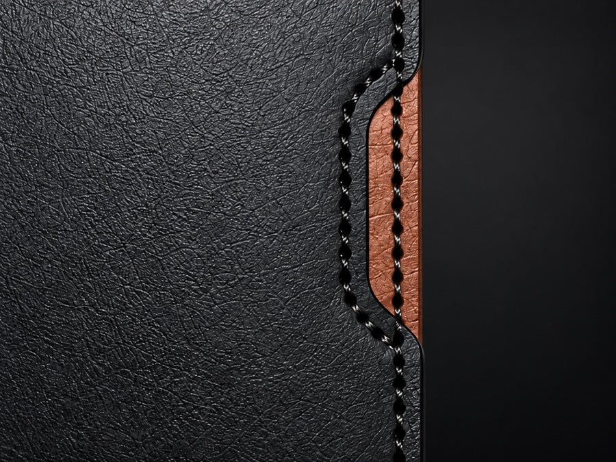 Close-up of the OB-01 signature angled cutout revealing the walnut interior