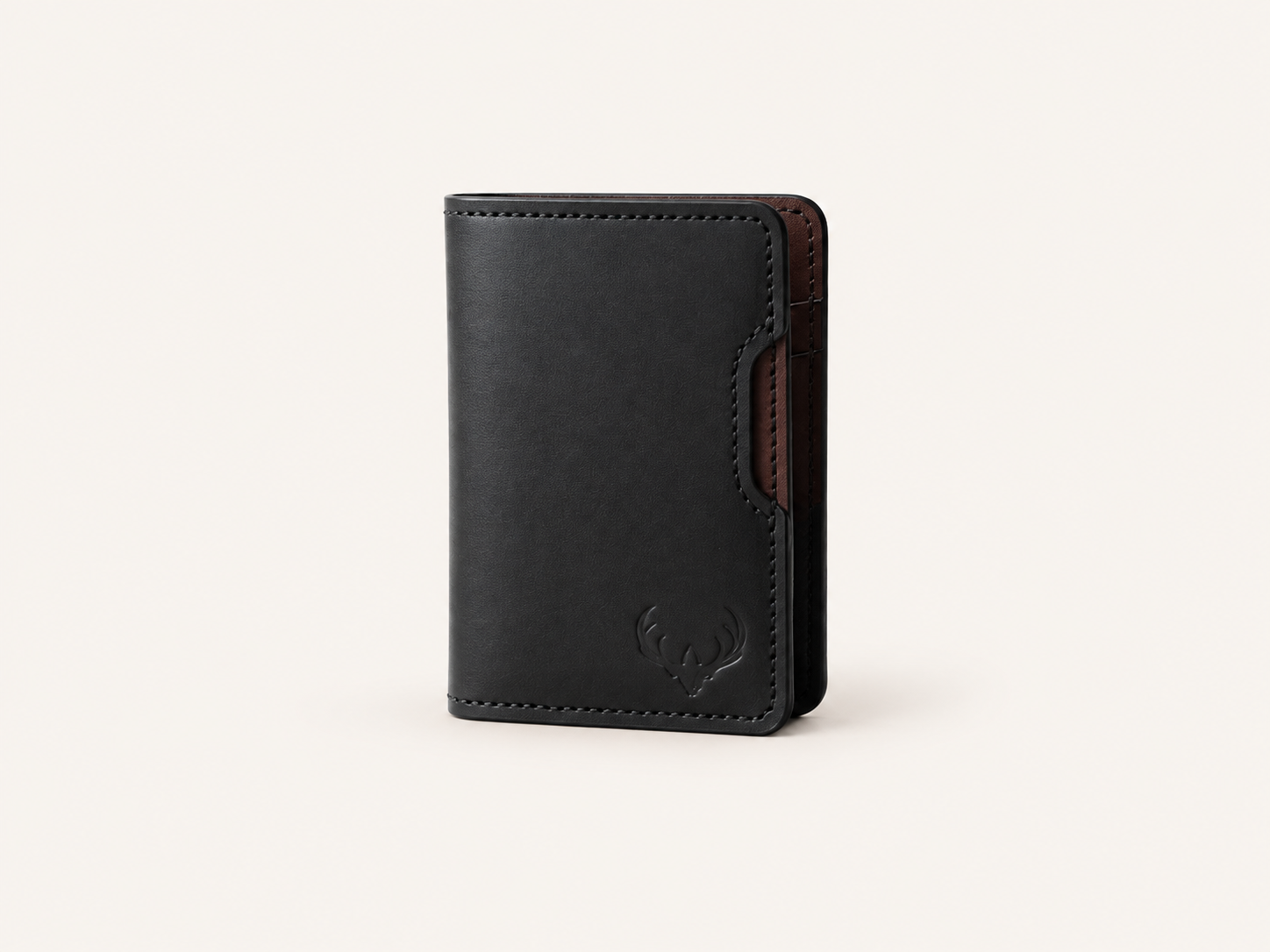 Black OB-01 wallet exterior on an off-white background, showing hand stitching, angled cutout, and Maker’s Mark