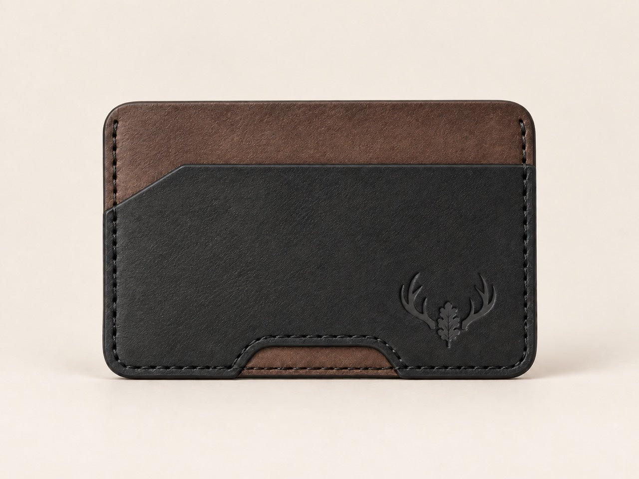 Front-facing Black and Walnut OB-03 card wallet with angled pocket opening and embossed Oak Buck antlers and oak leaf